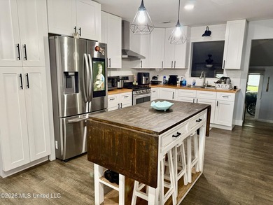 Welcome to Eastlawn! This updated 3-bedroom, 2-bath home sits on - photo 4