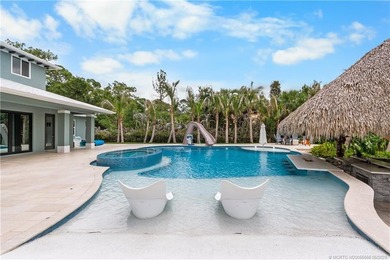 Behind a private electronic gate in prestigious Palm City Farms - photo 33