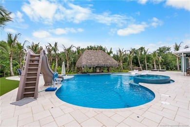 Behind a private electronic gate in prestigious Palm City Farms - photo 35