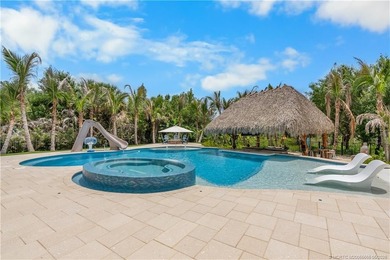 Behind a private electronic gate in prestigious Palm City Farms - photo 36