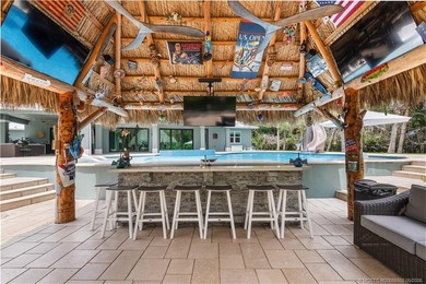 Behind a private electronic gate in prestigious Palm City Farms - photo 42