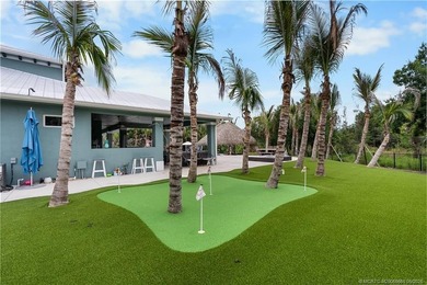 Behind a private electronic gate in prestigious Palm City Farms - photo 45