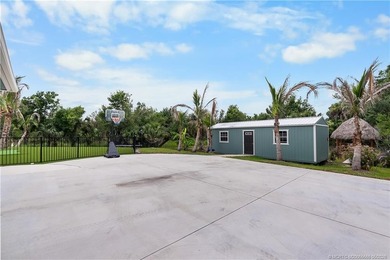 Behind a private electronic gate in prestigious Palm City Farms - photo 47