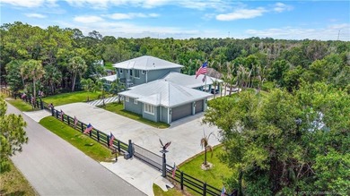 Behind a private electronic gate in prestigious Palm City Farms - photo 48