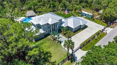 Behind a private electronic gate in prestigious Palm City Farms - photo 49