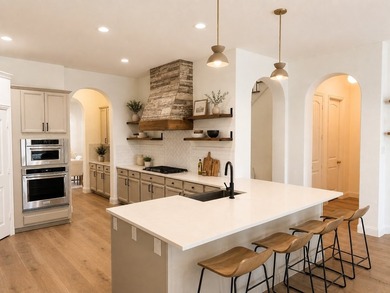 Exquisitely updated 4-bedroom, 1.5-story custom home in a gated - photo 3