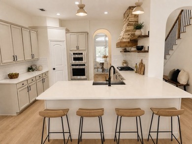 Exquisitely updated 4-bedroom, 1.5-story custom home in a gated - photo 4