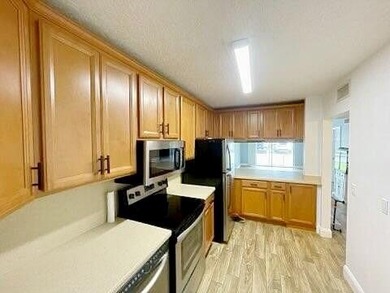 This updated first-floor condo is located in a well-established - photo 7