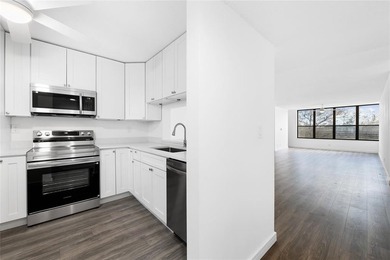 Ascend to the 4th floor of this 2-bed, 2-bath condo, nestled in