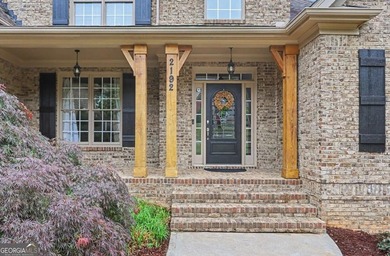 Welcome to this stunning 3-side brick home in the sought-after - photo 4