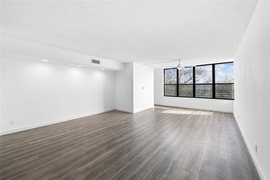 Ascend to the 4th floor of this 2-bed, 2-bath condo, nestled in