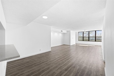 Ascend to the 4th floor of this 2-bed, 2-bath condo, nestled in