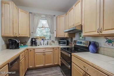 Nestled in a highly desirable golf cart community, this spacious - photo 9