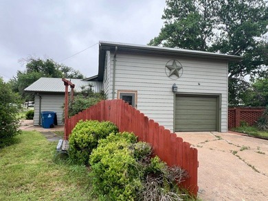 This home has one large bedroom and a half bath upstairs, and - photo 3