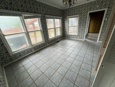 This home has one large bedroom and a half bath upstairs, and - photo 8