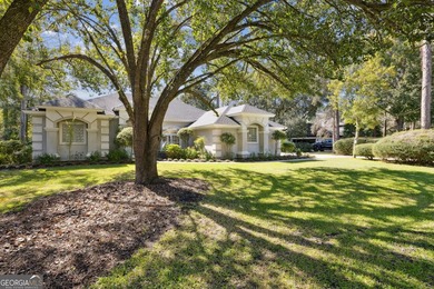 THIS BEAUTIFULLY UPDATED THREE-BEDROOM HOME IN OSPREY COVE IS - photo 4