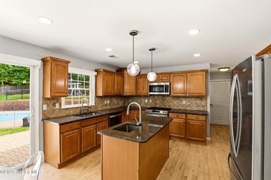 Welcome home to this spacious and beautifully maintained Center - photo 15