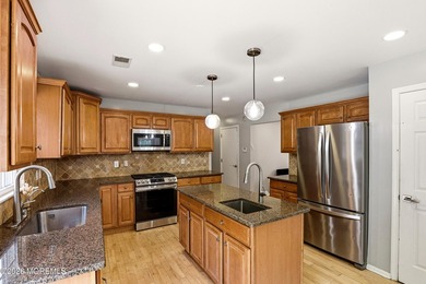 Welcome home to this spacious and beautifully maintained Center - photo 16