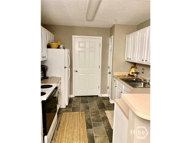 Enjoy coffee on your private patio! This charming 1BR/1BA condo - photo 9