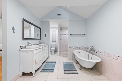 Discover a rare blend of coastal elegance and serene lakefront - photo 11