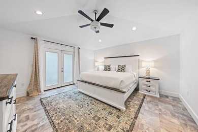 Discover a rare blend of coastal elegance and serene lakefront - photo 13