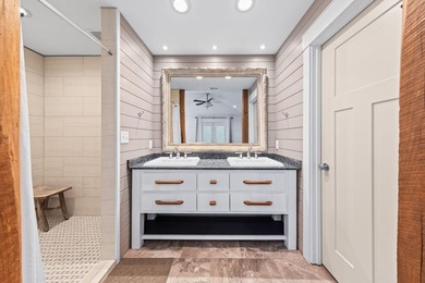 Discover a rare blend of coastal elegance and serene lakefront - photo 14