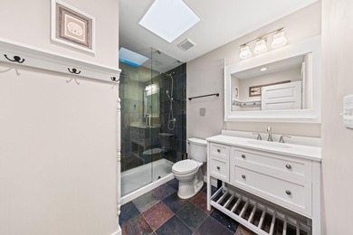 Discover a rare blend of coastal elegance and serene lakefront - photo 17