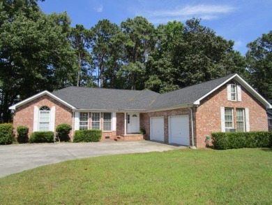 Golf course brick ranch home in Santee Cooper Resort features 3 - Lake Home For Sale in Santee, South Carolina