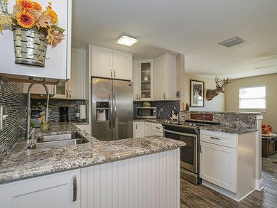 Now this is the total package! Waterfront + renovated 2/2 + - photo 9