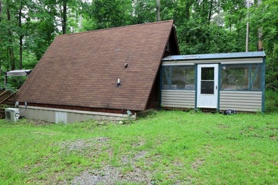Lots of potential in this cute A-frame home tucked away on a - photo 3