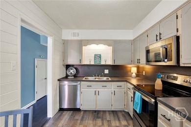Fresh paint, gorgeous engineered hardwood flooring, and easy - photo 8