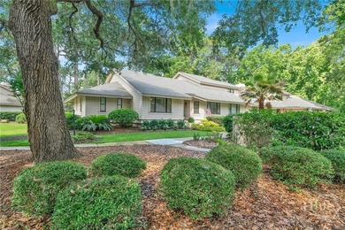 This exceptionally updated, one-level end unit on the lagoon is - photo 1