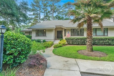 This exceptionally updated, one-level end unit on the lagoon is - photo 2