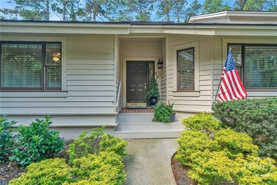 This exceptionally updated, one-level end unit on the lagoon is - photo 3