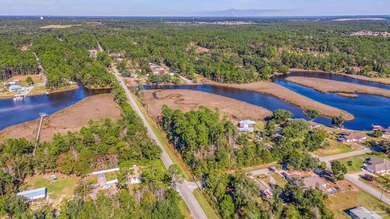 Nestled on nearly half an acre of serene waterfront property - photo 3