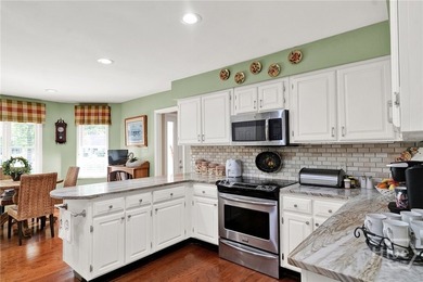 This exceptionally updated, one-level end unit on the lagoon is - photo 7