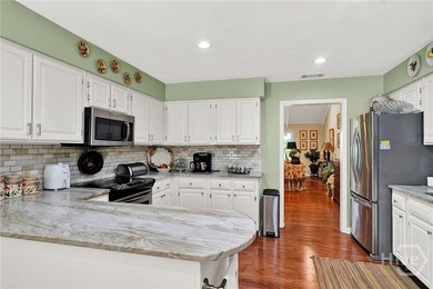 This exceptionally updated, one-level end unit on the lagoon is - photo 9