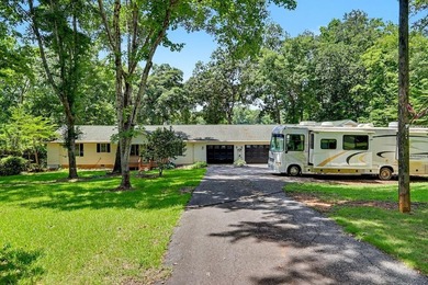 Charming 3 bedroom 2 bath home nestled on the banks of beautiful - photo 1