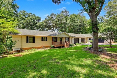 Charming 3 bedroom 2 bath home nestled on the banks of beautiful - photo 3