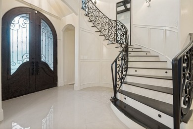 Nestled within the prestigious gated community of Lake Ridge - photo 2