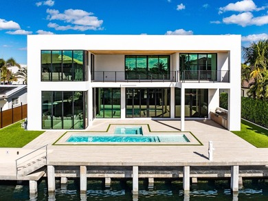 Now complete and move-in ready, 750 NE 69th Street is a striking - photo 1