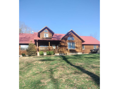 INCREDIBLE CONTEMPORARY LOG HOME. BOASTS 5 BEDROOMS AND 2.5 - photo 1