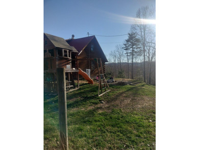 INCREDIBLE CONTEMPORARY LOG HOME. BOASTS 5 BEDROOMS AND 2.5 - photo 2
