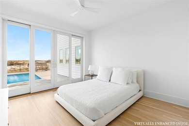 Set along coveted Dune Road, this jetty-protected oceanfront - photo 12