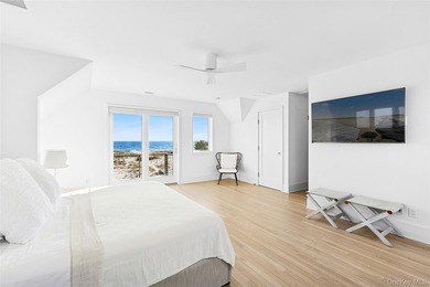Set along coveted Dune Road, this jetty-protected oceanfront - photo 14