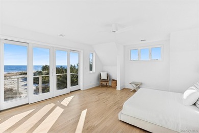 Set along coveted Dune Road, this jetty-protected oceanfront - photo 16