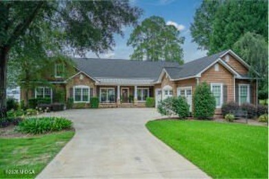 Welcome to 245 Lakeshore Circle, a stunning lakefront retreat - photo 2
