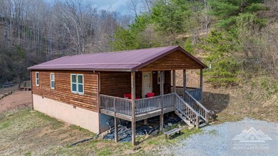 This is a 2 bedroom 1 full bath cabin with natural gas heat pump - photo 2