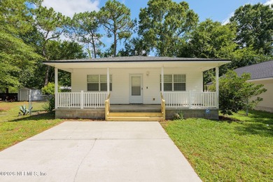 This charming cottage-style home with 3 beds + 2 baths is - photo 1