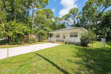 This charming cottage-style home with 3 beds + 2 baths is - photo 3